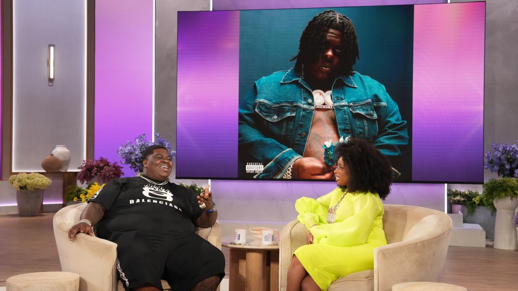 Two people talking about his album