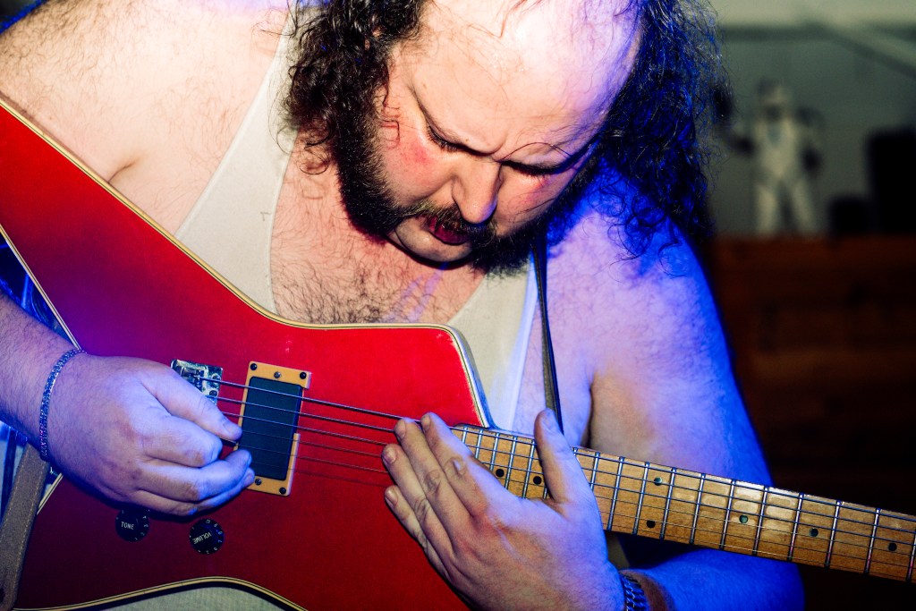 Man on stage performing