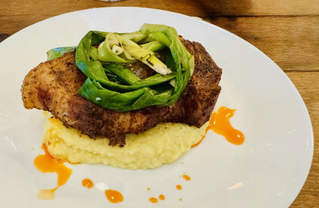 fire kissed pork chops over smoked ghee grits