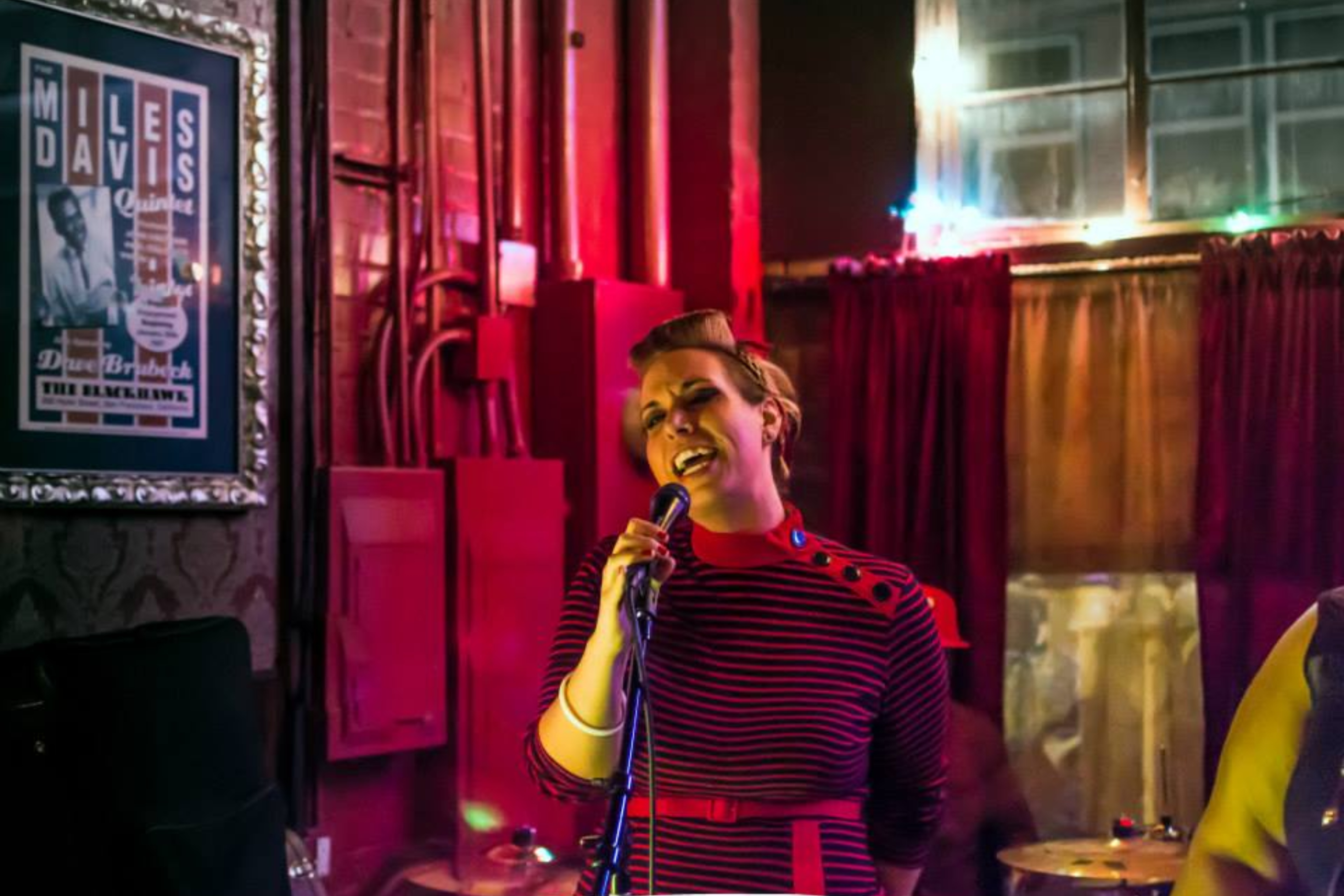 Woman singing on stage