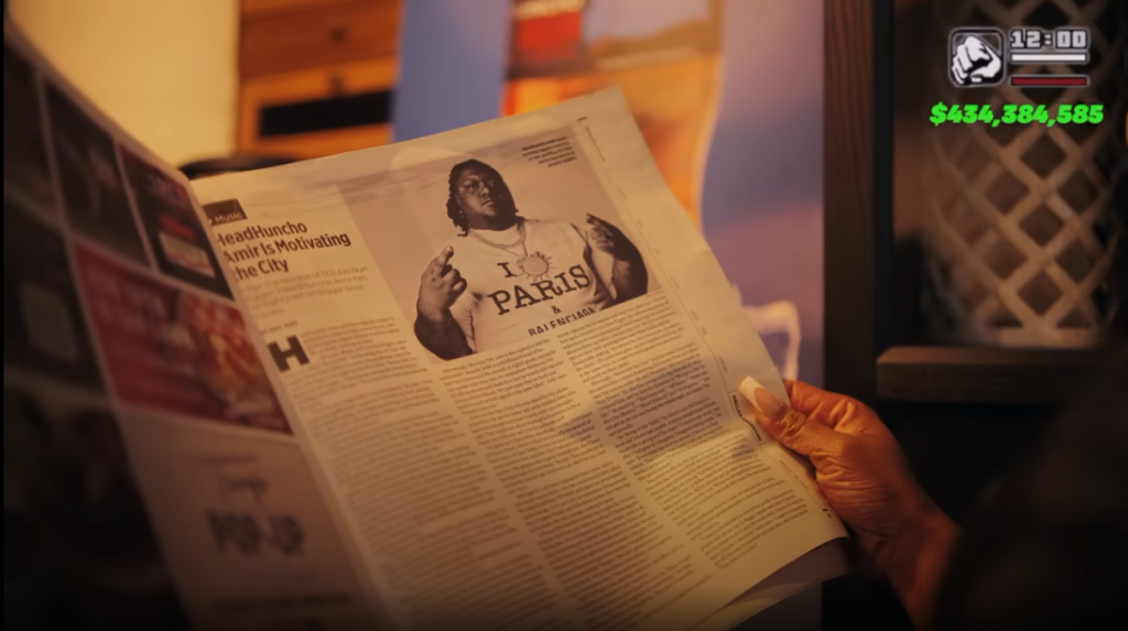 A photo of a newspaper open to a story about HeadHuncho Amir