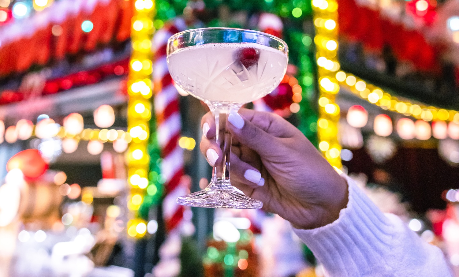 Raising a cocktail before Christmas lights a the Third Rail bar in Grapevine