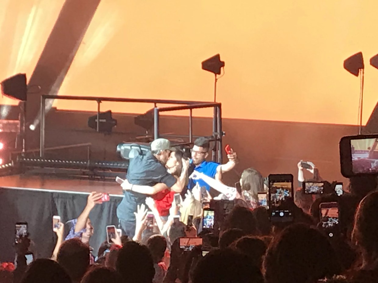 Enrique Iglesias Kisses Fan During Stop at AAC Show with Co-Headliner Pitbull