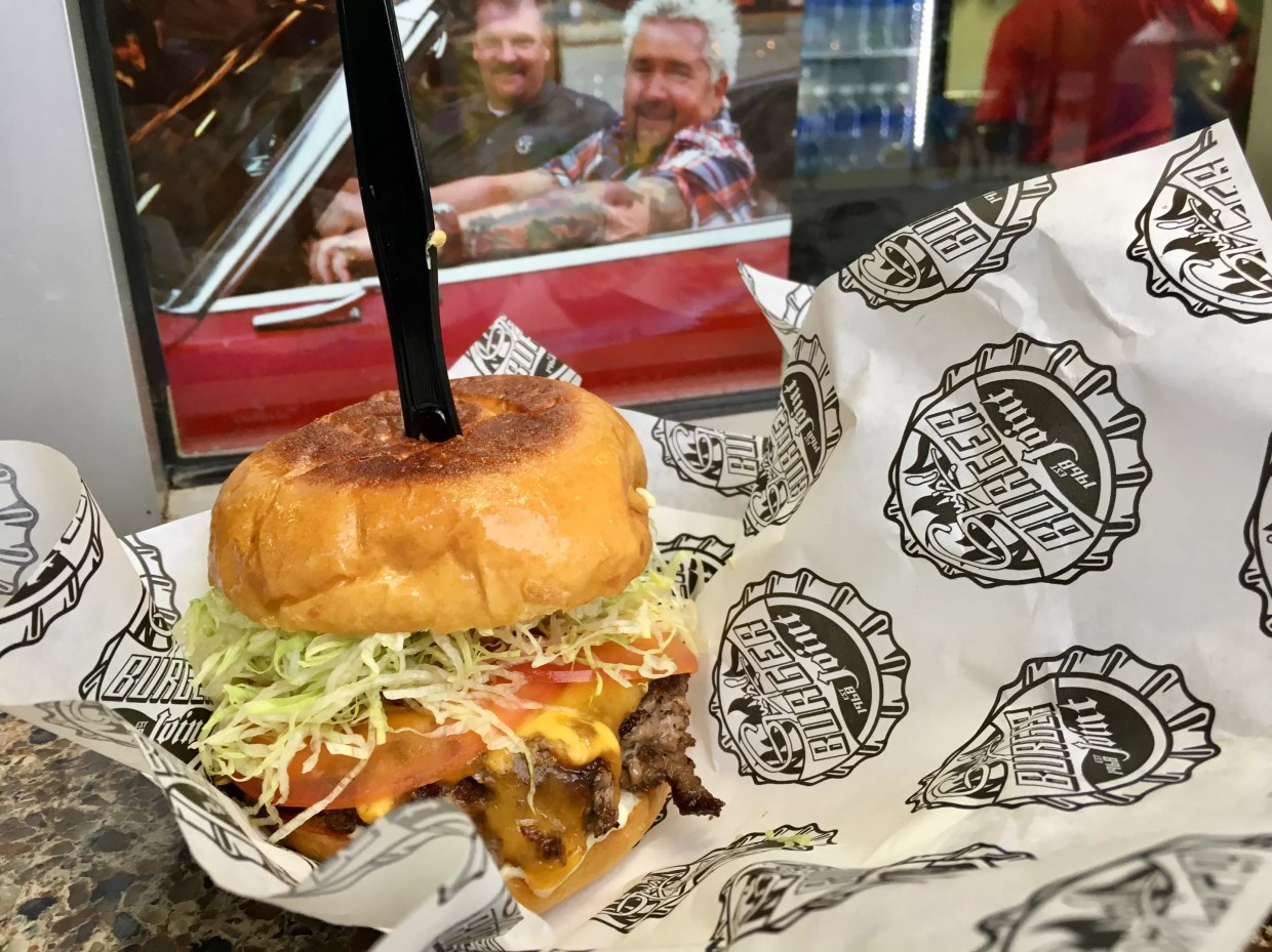 A Burger and Fries at Guy Fieri’s Burger Joint Have 2,460 Calories, and They’re Not Good