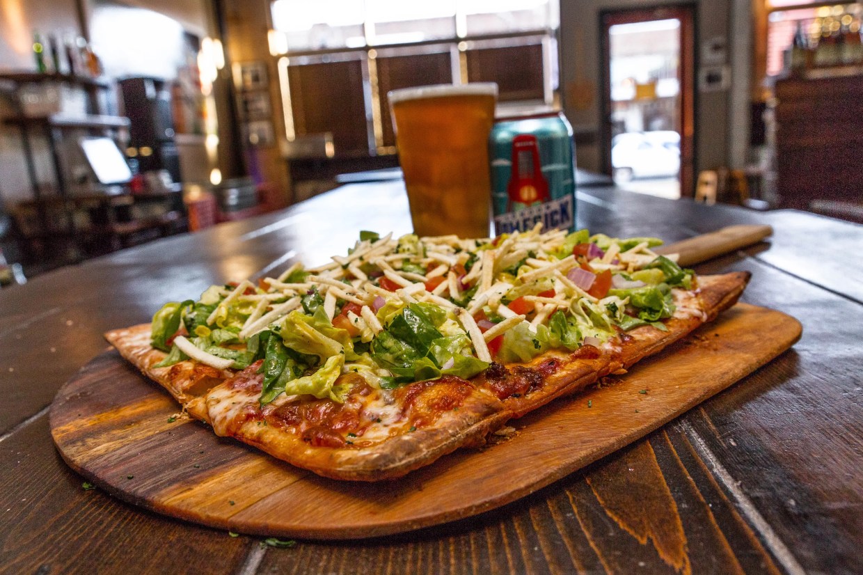 Behold the Cheeseburger and Fries Pizza at Stonedeck