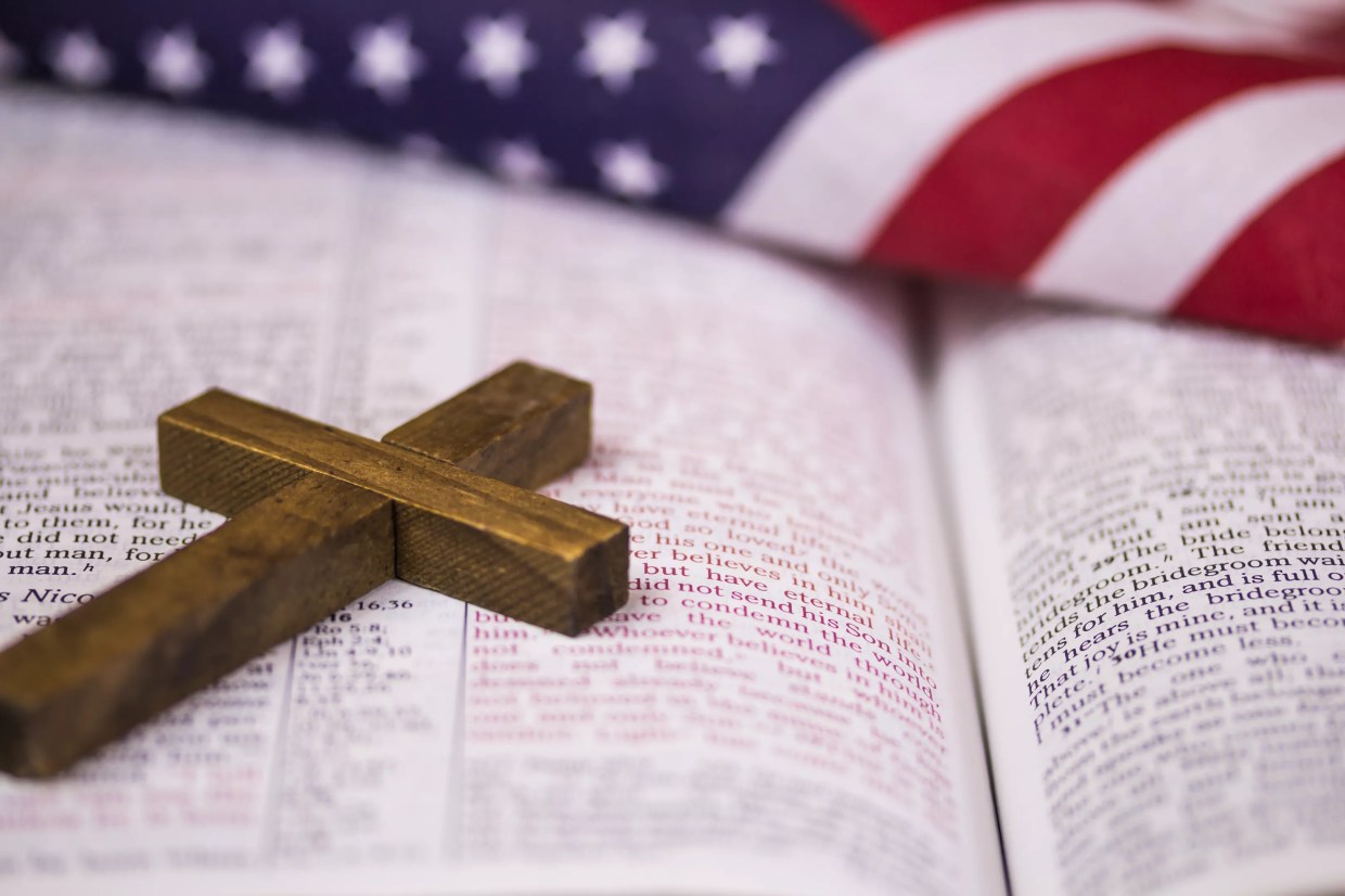 the Bible, a cross and a flag
