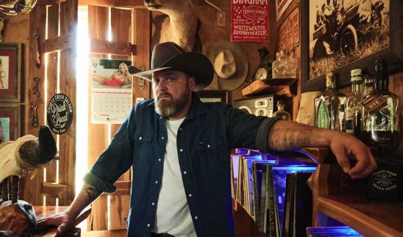 Man with cowboy hat posing