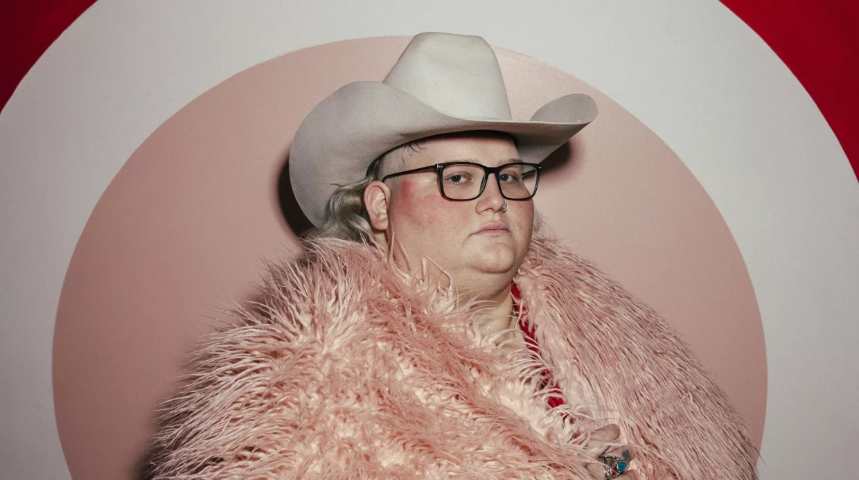 Joshua Ray Walker, seen in a pink furry coat and white hat, opened up about his recent medical scares, including a cancer diagnosis, for which he's currently undergoing chemo.