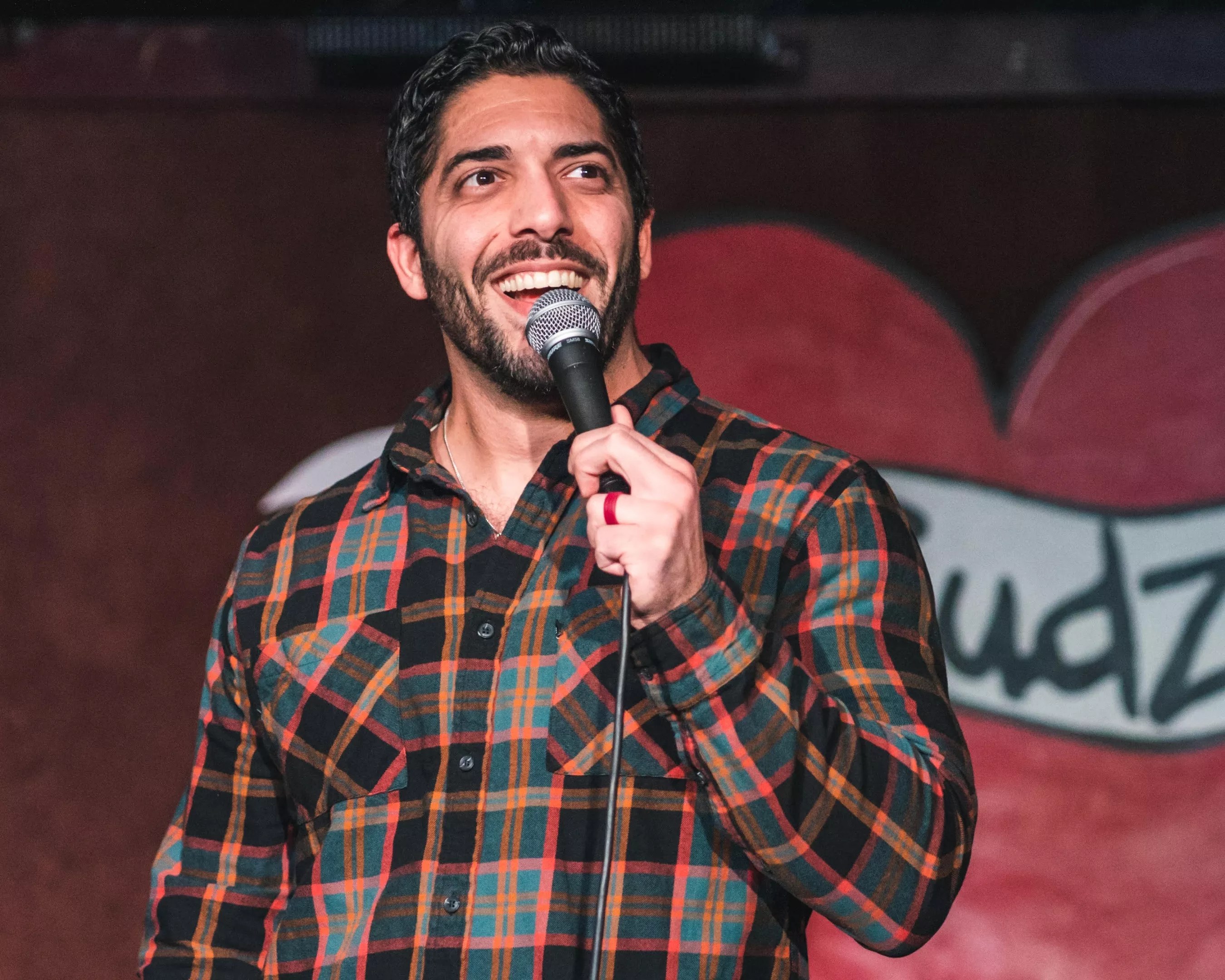Shayhan Jahani performs on the mic. He is one of Dallas' best comedians to watch this year.