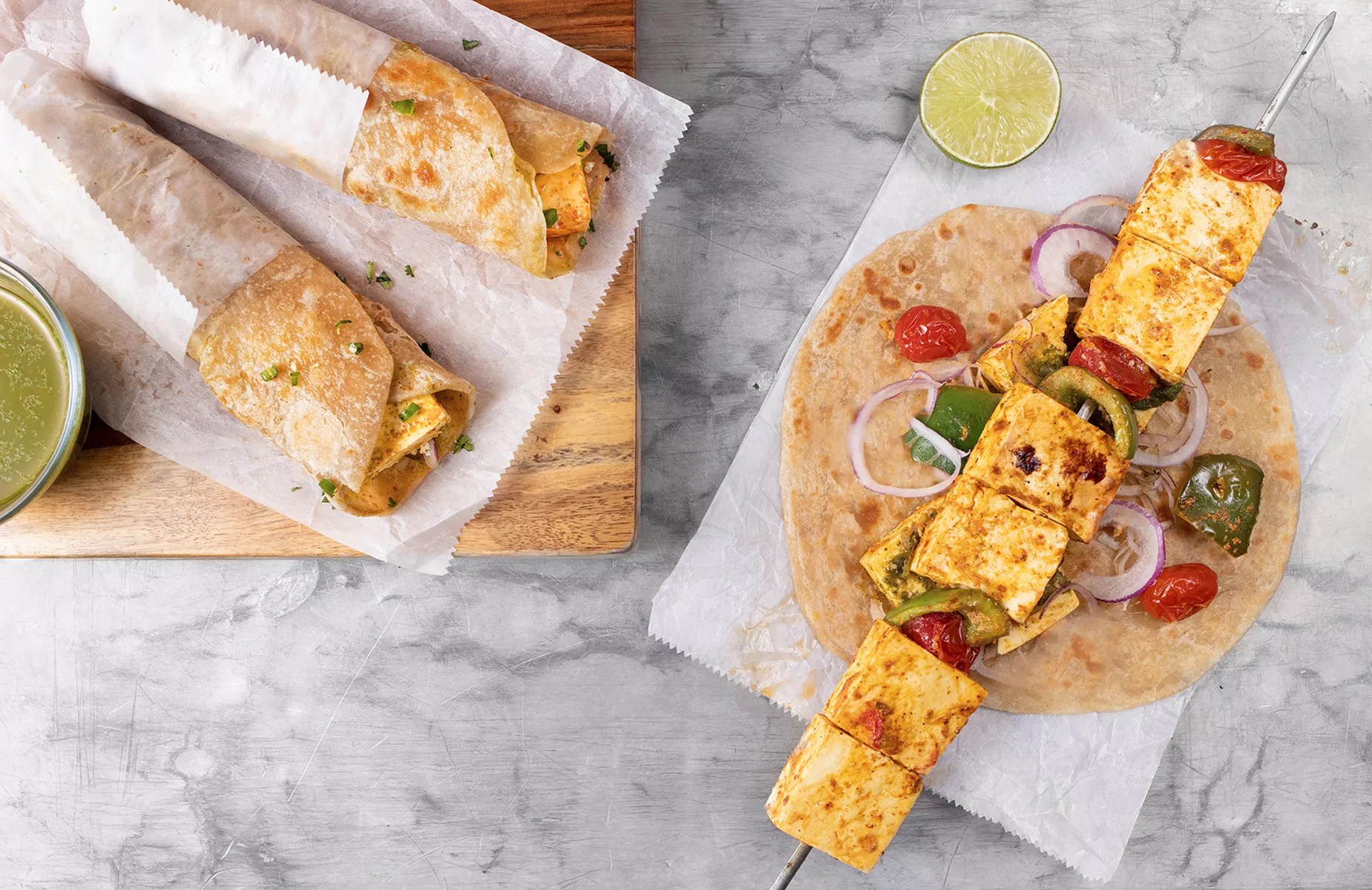 Kati Roll's achari paneer roll, featuring marinated and grilled paneer cheese.