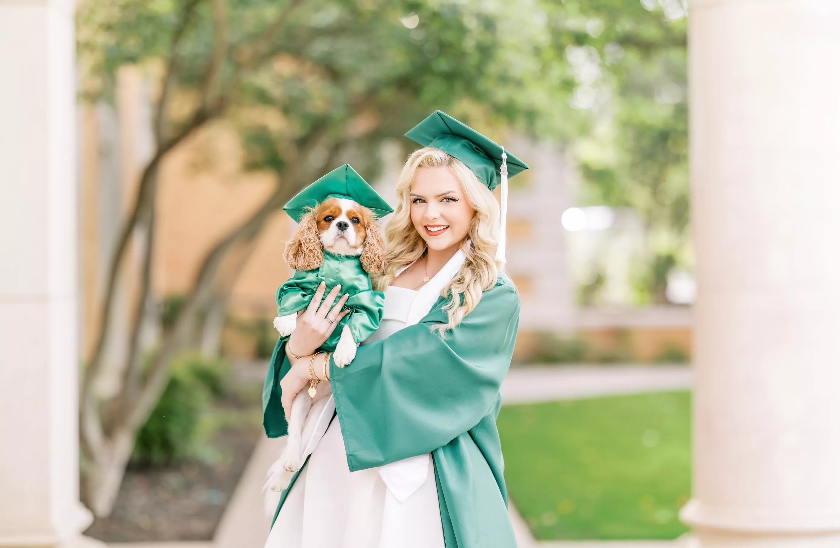 Lauren Clark and her dog Holly pose for Clark's graduation photos.