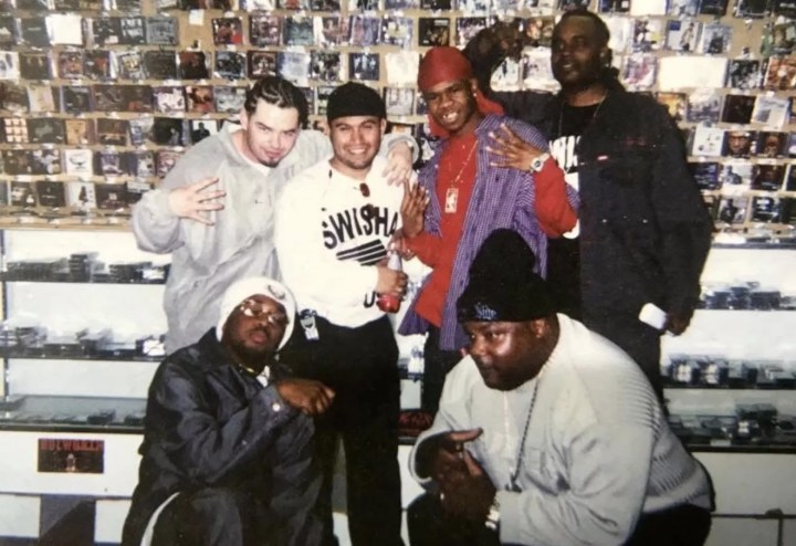 An early '90s photo taken at T-Town Music, which influenced the sound of Southern rap, with owner George Lopez (second from top left).