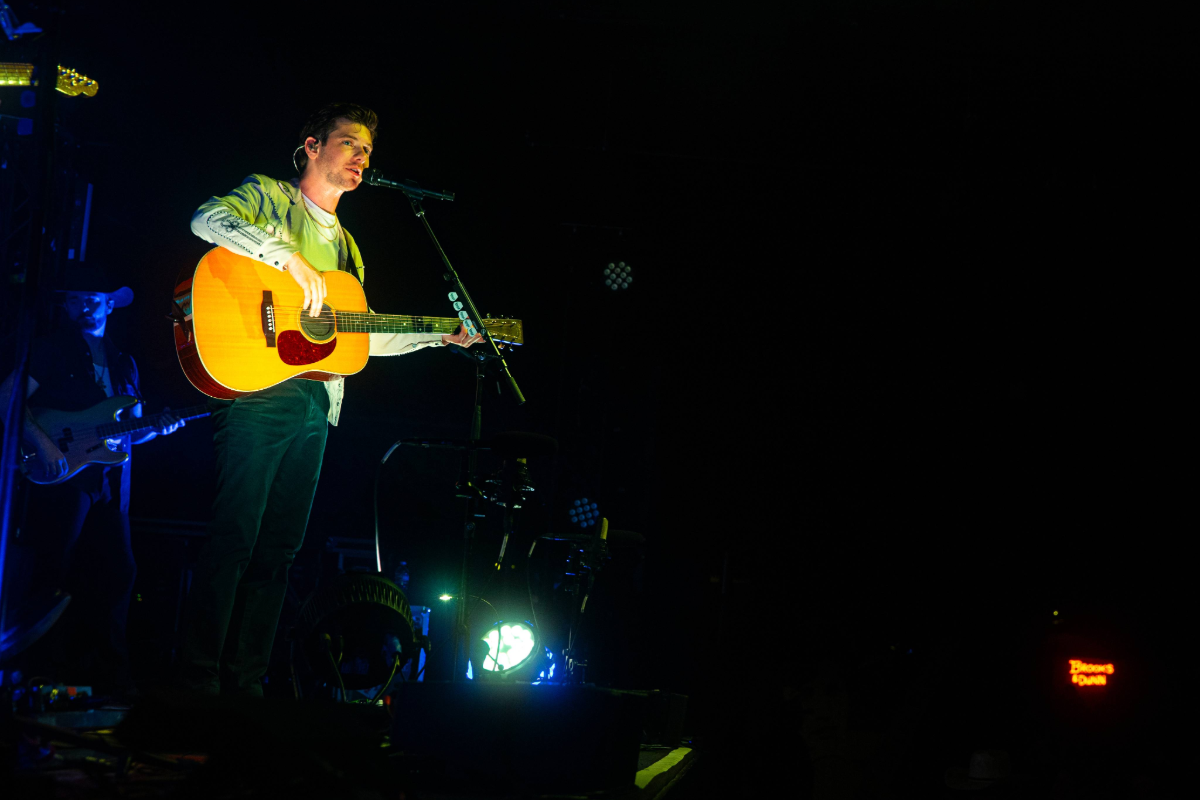 Man performing with guitar