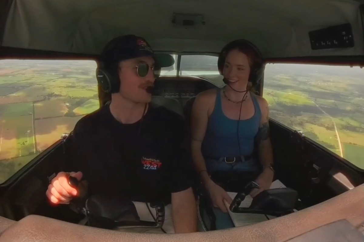 Two people in a plane talking