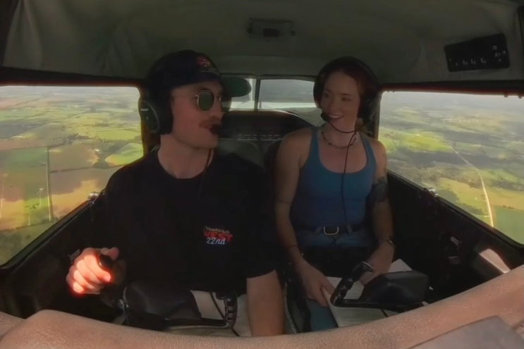 Two people in a plane talking