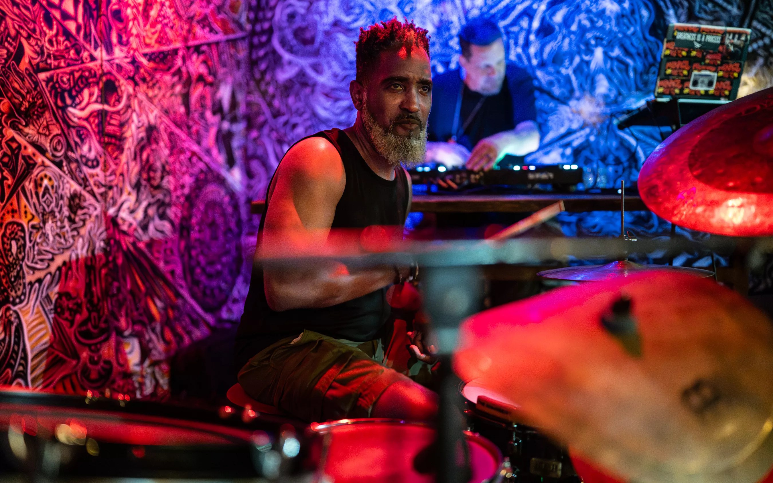Man drumming on stage