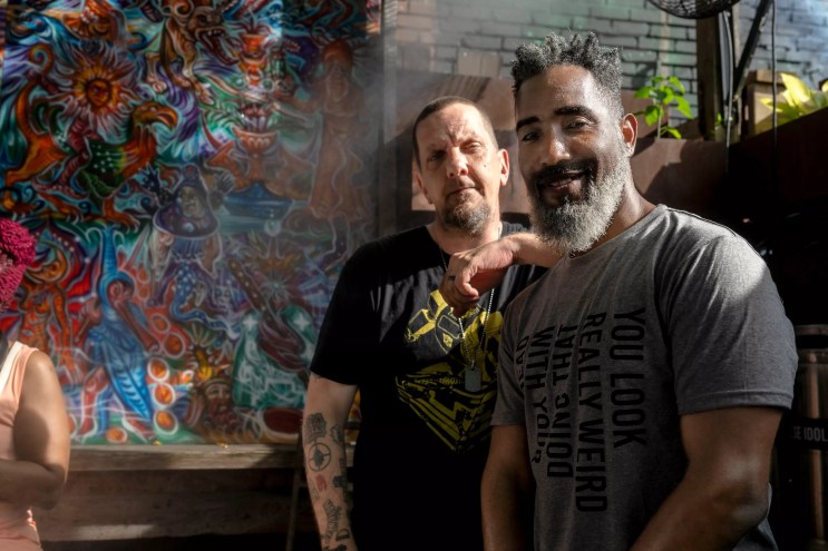 Two guys posing for a photo